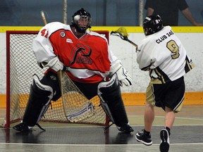 The Point Edward Pacers Ian Ferguson makes a save on the Windsor Clippers James Morgan during lacrosse action at Forest Glade Arena in Windsor on Wednesday, June 3, 2015.                (TYLER BROWNBRIDGE/The Windsor Star)