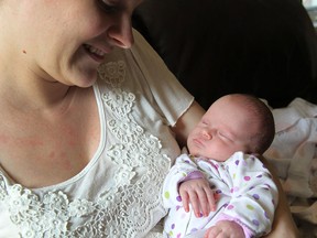 Sandra Dick holds her daughter Kara at their home in Leamington on Wednesday, April 29, 2015. Kara was born at Leamington Hospital last week.                  (TYLER BROWNBRIDGE/The Windsor Star)
