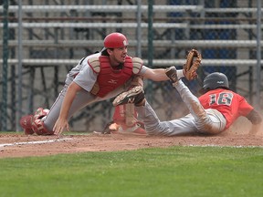 Windsor  Selects  18U, Kyle Gagnon is tagged out at home plate by Ontario Nationals catcher Colton Fountain during the Premier League of Baseball Championships held in Windsor, Ontario on June 26, 2015. (JASON KRYK/The Windsor Star)