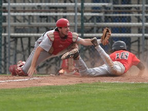 Windsor  Selects  18U, Kyle Gagnon is tagged out at home plate by Ontario Nationals catcher Colton Fountain during the Premier League of Baseball Championships held in Windsor, Ontario on June 26, 2015. (JASON KRYK/The Windsor Star)