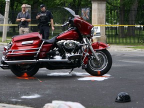 Windsor police investigate after a motorcycle and a minivan collided at the intersection of Richmond Street and Chilver Road in Windsor on Thursday, June 4, 2015.               (TYLER BROWNBRIDGE/The Windsor Star)