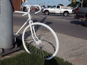 A ghost bike is seen at the corner of Parent Avenue and Tecumseh Road which marks where a cyclist was killed in Windsor on Monday, June 29, 2015.                    (TYLER BROWNBRIDGE/The Windsor Star)