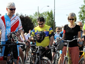 Cyclists take a moment of silence before taking part in a tribute ride for the two cyclist killed in Windsor on Monday, June 29, 2015. The ride was planned to bring awareness and promote safe cycling.                    (TYLER BROWNBRIDGE/The Windsor Star)