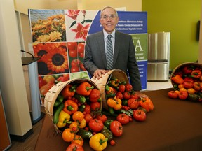 Energy Minister Bob Chiarelli met with local greenhouse operators at WindsorEssex Economic Development Corporation to talk about greenhouse operators who have benefited from various electrical programs. (JASON KRYK/The Windsor Star)