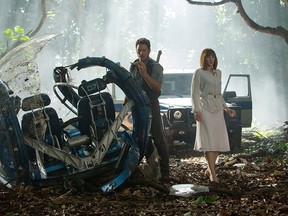 This photo provided by Universal Pictures shows, Chris Pratt, left, and Bryce Dallas Howard in a scene from the film, "Jurassic World," directed by Colin Trevorrow, in the next installment of Steven Spielberg's groundbreaking "Jurassic Park" series. (Chuck Zlotnick/Universal Pictures via AP)