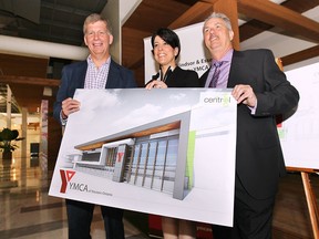 The YMCA of Western Ontario and King Developments announced a partnership on Thursday, June 18, 2015, that will see a multi-million dollar investment to the Central Park Athletics complex in Windsor, ON. Shaun Elliott, left, CEO YMCA of Western Ontario, Leigh Ann and James King pose with a rendering of the new facility at a media conference at the complex. (DAN JANISSE/The Windsor Star)