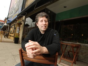 Ryan Smith, owner of Pause Cafe, sits outside his cafe on Chatham St. West, Friday, June 5, 2015.  (DAX MELMER/The Windsor Star)