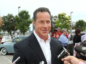 To mark their 90th anniversary FCA Canada (formerly Chrysler Canada) hosted a party for their employees at the Dieppe Park in Windsor, ON. on Wednesday, June 17, 2015. Featured were many historic vehicles built in the city over the decades. FCA Canada President and CEO Reid Bigland speaks to reporters during the event.  (DAN JANISSE/The Windsor Star)