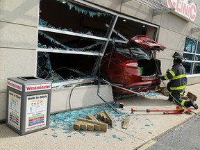 A car sits in the waiting room of a walk in clinic on Tecumseh Road in Windsor on Monday, June 8, 2015. The car crashed through the front of the building injuring several people inside.               (TYLER BROWNBRIDGE/The Windsor Star)