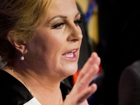 In this Sunday, Jan. 11, 2015 file photo, Kolinda Grabar-Kitarivic celebrates her victory in presidential elections, in Zagreb, Croatia. The conservative  become Croatia's first female president after beating the center-left incumbent in a runoff election amid deep discontent over economic woes in the European Union's newest member. (AP Photo/Darko Bandic, File)