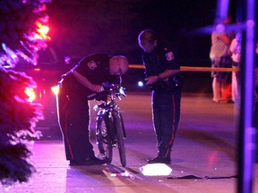 LaSalle police investigate after a cyclist was found suffering from injuries on Huron Street in LaSalle on Thursday, June 18, 2015.                  (TYLER BROWNBRIDGE/The Windsor Star)