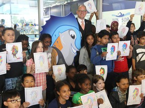 Windsor Mayor Drew Dilkens and students from Dougall Public School during the official launch of the FINA WSC16 "Name Our Mascot" Contest.   The Windsor FINA 2016 World Swimming Championship (FINA WSC16) announced the competition to name the new mascot on June 1, 2015.  Entries for the contest will only be accepted online at www.finawindsor2016.com/mascotname .  The contest will be open to children between the ages of 4 to 17.   Entrants must reside and go to school in the City of Windsor and Essex County.  The grand prize winner will receive an Apple iPad-mini, and four passes to the FINA 2014 World Swimming Championship opening ceremonies.  In addition they will receive a visit by the FINA Mascot and enjoy a complimentary lunch provided by SUBWAY.    (JASON KRYK/The Windsor Star)