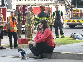 Residents of a high-rise apartment building in the 2900 block of Wildwood Drive in Windsor, Ont. had to evacuate the premises as a fire broke out in a third floor unit around 7:30 a.m. No one was hurt in the incident. Fire crews worked for several hours to ventilate the building. Mackensie Janisse who was visited her mother at the building waits outside of the complex. (DAN JANISSE/The Windsor Star)