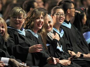 The University of Windsor held its spring convocation ceremony on Tuesday, June 16, 2015, at the St. Denis Centre in Windsor. Graduates from the Faculty of Education and Graduate Studies received their degrees during the ceremony. Some of the graduates are shown during the ceremony. (DAN JANISSE/The Windsor Star)