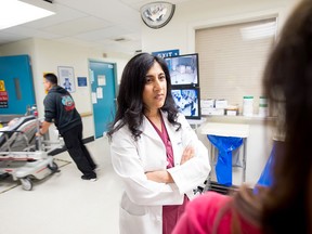 In this June 4, 2015 photo, Dr. Reena Duseja, lead author of a study on emergency room visits, stands in San Francisco General Hospital's emergency room in San Francisco. No one wants to make a repeat visit to the emergency room for the same complaint. But new research suggests it's more common than previously thought, and people frequently wind up at a different ER the second time around. (AP Photo/Noah Berger)
