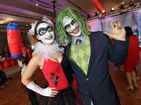 Tiffany Wolter and Ryan Fields (left to right) attend the Heroes and Villains gala in support for the Art Gallery of Windsor at the St. Clair Centre for the Arts in Windsor on Friday, June 12, 2015. The Heroes and Villains: The Comic Book Art of Alex Ross and Between the Panels: The Comics Art of David Collier, David Finch, Jeff Lemire, and Kagan McLeod exhibit continues through Sept. 20 at the Art Gallery of Windsor (TYLER BROWNBRIDGE/The Windsor Star)