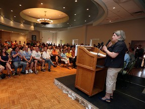 MPP Taras Natyshak, MPP Lisa Gretzky, NDP leader Andrea Horwath and MPP Percy Hatfield (left to right) take part in a town hall meeting to discuss the Ontario governments plan to sell off a share of Hydro One in Windsor on Tuesday, June 24, 2015.                  (TYLER BROWNBRIDGE/The Windsor Star)