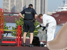 Windsor police officers investigate the scene of an alleged sexual assault at at a riverfront park on Monday, June 29, 2015 just east of downtown Windsor, ON. (DAN JANISSE/The Windsor Star)