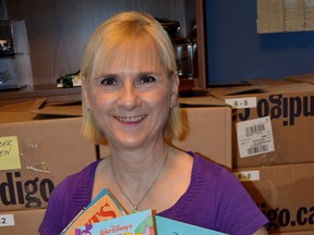 Tamye Machina, LaSalle resident and founder of Link to Literacy Children's Book Drive, poses with donated books on Tuesday, June 23, 2015. (JULIE KOTSIS/The Windsor Star)