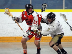 The Point Edward Pacers Liam Wright tries to cut around the Windsor Clippers Josh Jubenville during lacrosse action at Forest Glade Arena in Windsor on Wednesday, June 3, 2015. (TYLER BROWNBRIDGE/The Windsor Star)