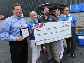 Bob Echlin, left, president of Lakeside Plastics Limited, Tina DeCarlo, event co-ordinator for Lakeside Plastics, Ron Dunn, executive director of the Downtown Mission, Cindy Bigelow, payroll co-ordinator for Lakeside Plastics,and Kenneth Siddall, Sr. Director  Human Resources at Lakeside Plastics on June 24, 2015 in Tecumseh, Ontario.   (JASON KRYK/The Windsor Star)