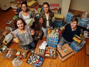 Riverside Secondary School students from left, Elaina Pardalis, 16, Jeevan Kooner, 16, Alexis Provost, 16, and Lucas Dodson, 17 display more than 4500 food products collected in the "Let's Jel"  fundraising campaign.  Can goods, boxed food, and  $320 in Zehr's gift cards have been delivered to the Windsor Downtown Mission.    "Let's Jel" is a non-profit initiative aimed at fundraising for various charities, and to inspire others to volunteer and give back to the community.    They will be continuing their efforts with a Facebook and website campaign.   (JASON KRYK/The Windsor Star)