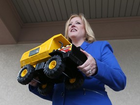 Lisa Raitt, federal minister of transport, speaks with the media after receiving a toy truck from local officials during a meeting to discuss potential opportunities for local companies to build the Gordie Howe Bridge. (JASON KRYK/The Windsor Star)