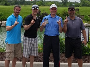 Local golfer Jim MacIntyre, third from left, stands with Darrin Prieus, left, Kyle Danby and Maurice Landry. MacIntyre used a nine-iron for a hole-in-one on the 150-yard 16th hole at Sutton Creek. It was witnessed by Landry, Danby and Prieus.