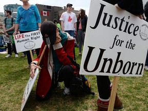 People take part in the "March For Life" on Parliament Hill in Ottawa on Thursday, May 8, 2014. THE CANADIAN PRESS/Sean Kilpatrick