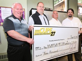 Members from CUPE local 27 donated $3,000 to the Downtown Mission on Wednesday, June 10, 2015. From left, CUPE members Dan MacNeil, Bill Murray and Jeff Ducharme pose with Ron Dunn, director of development and communications for the Downtown Mission. (DAN JANISSE/The Windsor Star)