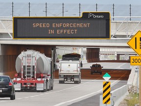 Traffic was flowing for the first full day on the Herb Gray Parkway on Monday, June 29, 2015, in Windsor, ON. A digital sign advising drivers of speed enforcement is shown in the westbound section. (DAN JANISSE/The Windsor Star)