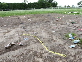 Discarded beer and alcohol bottles are shown in a ditch in front of The South Point Stables property at 9076 County Rd. 42 on Monday, June 15, 2015, where a massive prom party was held on Friday where three people were stabbed.  (DAN JANISSE/The Windsor Star)