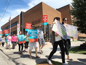 Members of different unions representing teachers and support staff with the Greater Essex County District School Board demonstrate in front of the board office on Tuesday, June 16, 2015, in Windsor. (DAN JANISSE/The Windsor Star)