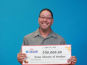 Windsor's Remo Silvestri poses with his cheque for $50,000. (Courtesy of OLG)