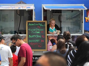 Large crowds attend the Sunset Truckin' Good Food at the waterfront at California Ave., Sunday, June 6, 2015.  A total of ten food trucks were in attendance.  The next Sunset Truckin' Good Food will take place July 25 and 26 at North 42 Degrees Estate Winery.  (DAX MELMER/The Windsor Star)