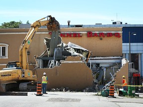 Demolition crews tear down the former TUNNEL BAR-B-Q restaurant in downtown Windsor, Ontario on June 23, 2015.  The property is being cleared for the new University of Windsor expansion. (JASON KRYK/ The Windsor Star)