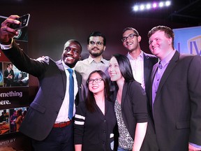 University of Windsor Students' Alliance president Jaydee Tarpeh (far left) takes a selfie with fellow UWSA members (back, from left) Sukhjot Singh, Jordan Renaud, Matthew Dunlop, and (front, from left) Diana Lu and Larissa Howlett. Photographed in The Windsor Star's News Cafe on June 12, 2015. (Dan Janisse / The Windsor Star)