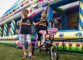 Amanda Loewen and her twin brother Matthew, 9, attend the Windsor Corporate Challenge on Saturday, June 20, 2015. (JESSELYN COOK/The Windsor Star)