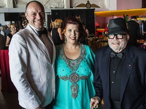 Marc Dubois, left, Shelley Sharpe and Dani Bobb attend the Windsor Symphony Orchestra gala at the Canadian Historical Aircraft Association on Saturday, June 6, 2015. (JESSELYN COOK/The Windsor Star)