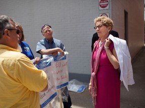 Premier Kathleen Wynne talks with OPSEU workers outside the Walkerville Brewery, Friday, June 19, 2015.  (DAX MELMER/The Windsor Star)