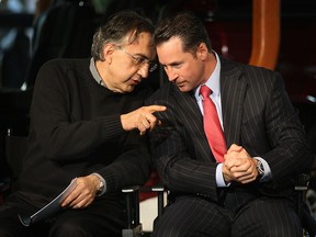 Sergio Marchionne, left, speaks with Reid Bigland, during a news conference at the Windsor Assembly Plant on Jan. 18, 2011 in Windsor. (DAN JANISSE / Windsor Star files)