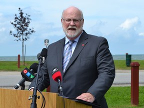 Leamington Mayor John Paterson talks about upgrades to the sanitary sewer system along Pelee Drive  on Tuesday, June 30, 2015, at Mersea Park on the shore of Lake Erie. Leamington will receive up to $4 million from the federal and provincial governments for the project. (JULIE KOTSIS / The Windsor Star)