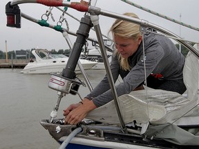 The Star’s Kelly Steele secures a sail aboard Firewater at Lakeview Park Marina during a recent outing. (NICK BRANCACCIO / The Windsor Star)