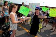 Emma Gregoire, left, delivers food to Linda Santos of Transition to Betterness on Malden Road on Saturday July 04, 2015. Gregoire, who turned 14 on June 19, wanted to give back to the community rather than celebrate with a traditional birthday party. Santos accepted the generous donation which are destined for patients at the Tayfour Campus of Windsor Regional Hospital. (NICK BRANCACCIO/The Windsor Star).