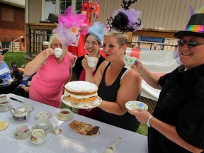 Dressed in their handmade fascinators, Marlayna Durka, left, Gill Luciw, Brittney Robinet, Marlene Mellor and Donna Hay, right, sip tea and celebrate the christening of royal baby Charlotte Sunday July 5, 2015.  Friends and neighbours enjoyed scones, clotted cheese and cookies while talking about all things British. (NICK BRANCACCIO/The Windsor Star).