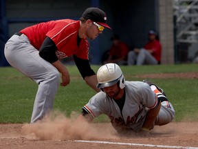 Windsor Selects first baseman Matt Deneau applies the tag to Chicago Lombard Orioles Blake Alexander at Cullen Field Sunday, July 5, 2015. Alexander was safe on the play. (NICK BRANCACCIO/The Windsor Star)