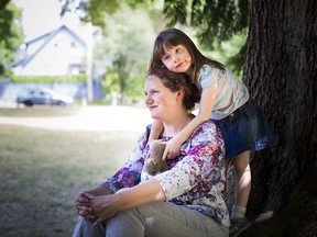 Monique Shebbeare and her daughter Maya, 5, are pictured at a park in Vancouver, British Columbia on JUNE 25, 2015. (BEN NELMS for National Post)
