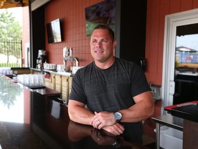 John O'Kane, owner of John Max Sports &; Wings on July 13, 2015 in Windsor, Ont.  O'Kane is shown at the Lauzon Parkway address, one of two John Max locations in Windsor. He became an Internet celebrity after putting notes and gift cards on cars left in his parking lot to thank people for not drinking and driving. (JASON KRYK/The Windsor Star)
