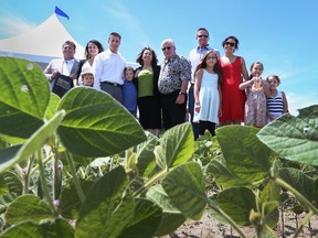 Windsor Regional Hospital president and CEO David Musyj joins the O'Keefe family for a portrait on their farm at County Road 42 and 9th Concession, which will be the home for the new regional mega-hospital.  (JASON KRYK/ The Windsor Star)