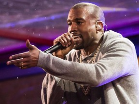 Kanye West performs during the World AIDS Day (RED) concert In Times Square in New York on Dec. 1, 2014. Not everyone is pleased by the announcement that American rap legend Kanye West will perform at the closing ceremony of the Pan Am Games in Toronto.An online petition asking the organizing committee to change its mind has garnered more than 11,000 supporters as of Thursday morning. THE CANADIAN PRESS/AP, Invision - Charles Sykes